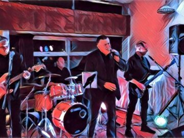 Salty Dogs 4 piece band on stage.